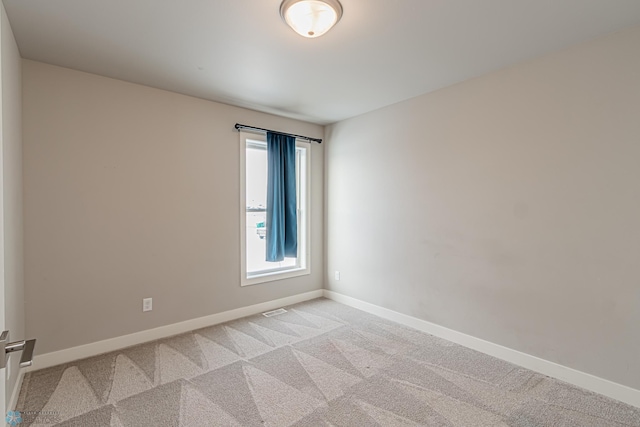 view of carpeted spare room