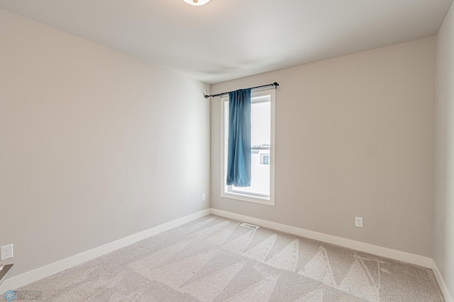 view of carpeted spare room