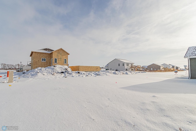 view of yard layered in snow