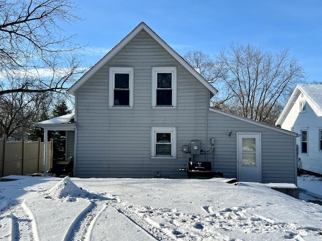 view of snow covered house