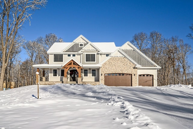 craftsman house featuring covered porch and a garage