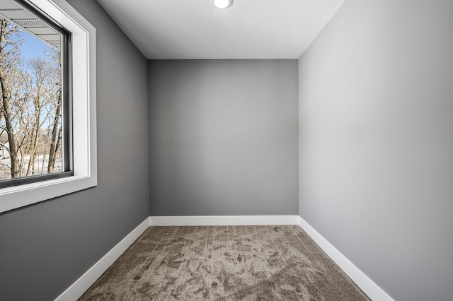 empty room featuring carpet floors and a textured ceiling