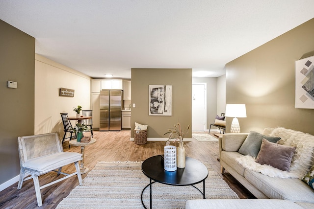 living room with light hardwood / wood-style flooring