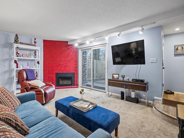 living room with carpet floors, a textured ceiling, and rail lighting