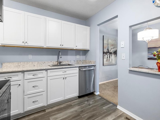 kitchen featuring stainless steel dishwasher, white cabinetry, sink, and dark wood-type flooring