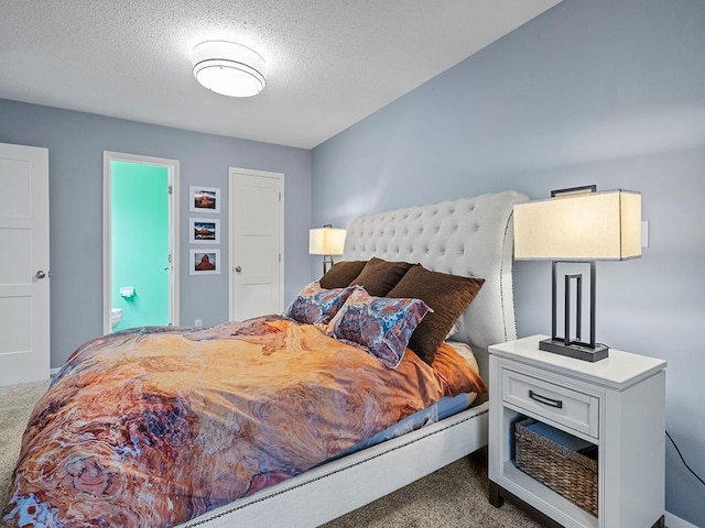 carpeted bedroom with a textured ceiling