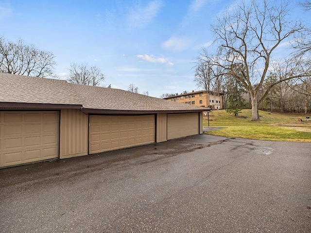 garage featuring a yard