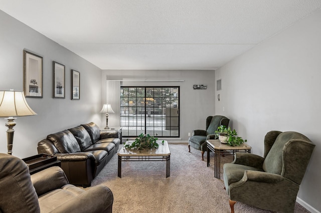 living room featuring a textured ceiling and carpet flooring