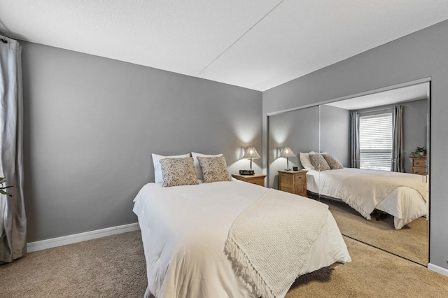 bedroom featuring a closet and carpet