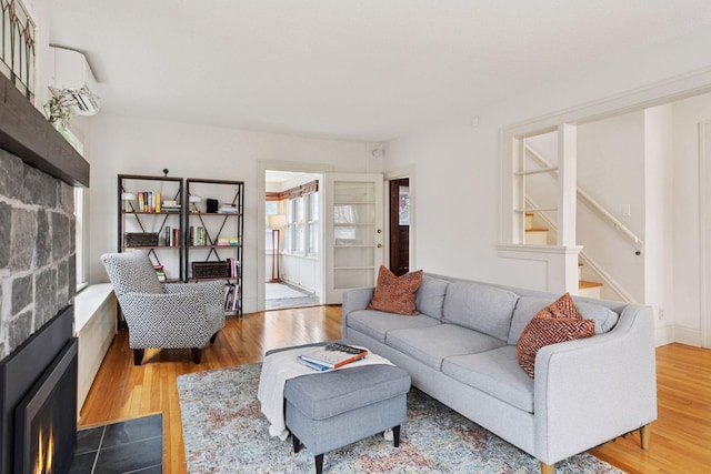 living room featuring stairs and wood finished floors