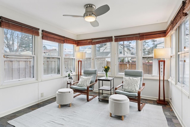 sunroom with a ceiling fan