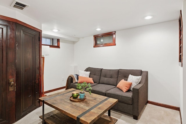 living area featuring light carpet, baseboards, and recessed lighting