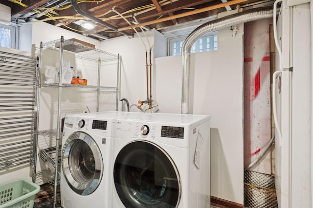 laundry room featuring laundry area, a wealth of natural light, and washer and dryer