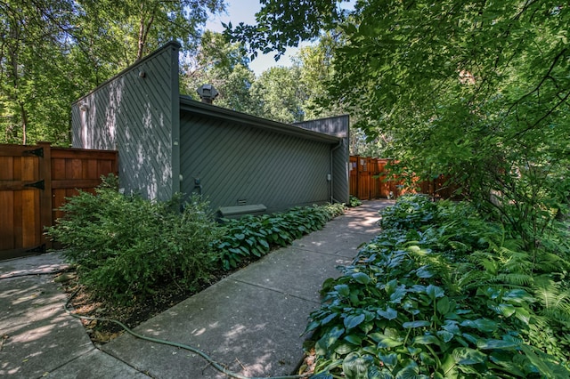 view of property exterior featuring fence