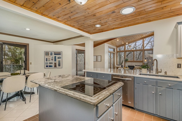 kitchen with a sink, black electric stovetop, light tile patterned floors, gray cabinets, and stainless steel dishwasher