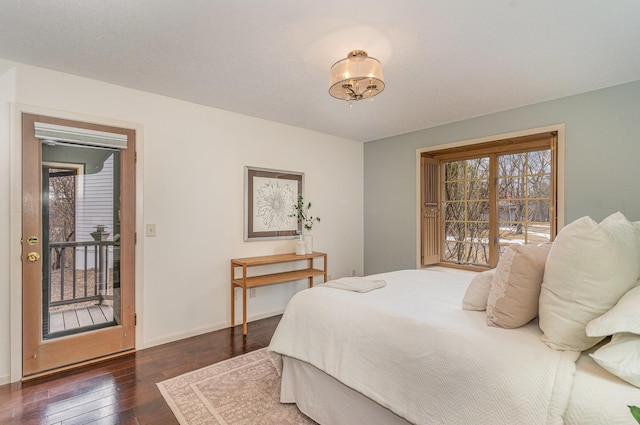 bedroom with baseboards and dark wood-style flooring