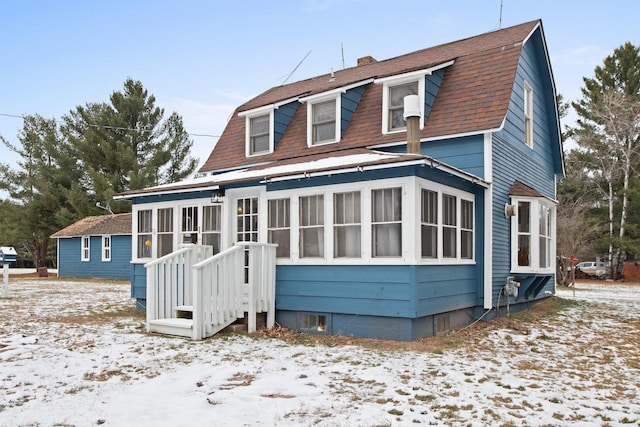 view of snow covered house