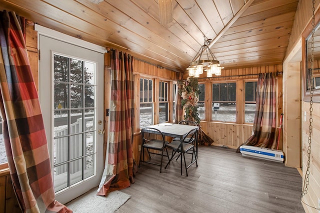 interior space featuring a chandelier, wooden ceiling, and lofted ceiling