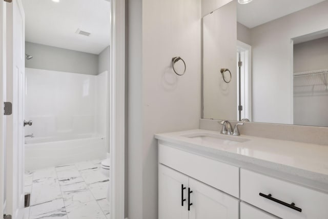 full bathroom with vanity, bathing tub / shower combination, and toilet