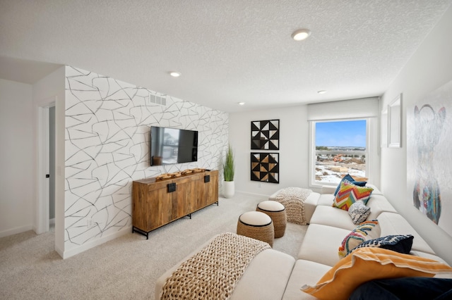 living room featuring light carpet and a textured ceiling