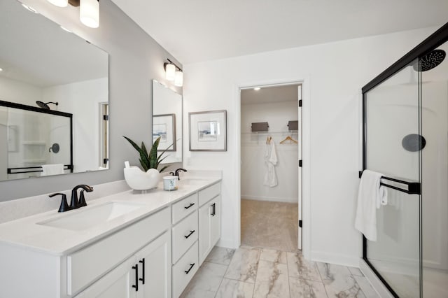 bathroom featuring vanity and a shower with door