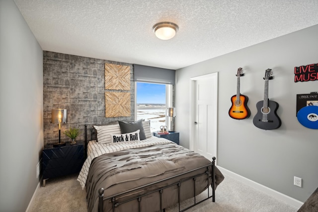 carpeted bedroom featuring a textured ceiling