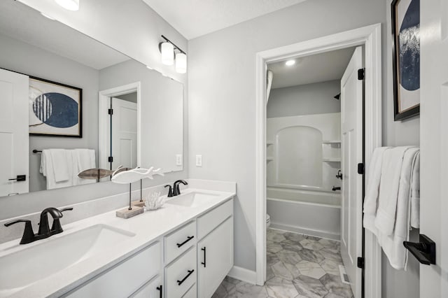 full bathroom featuring toilet, vanity, shower / bathing tub combination, and a textured ceiling