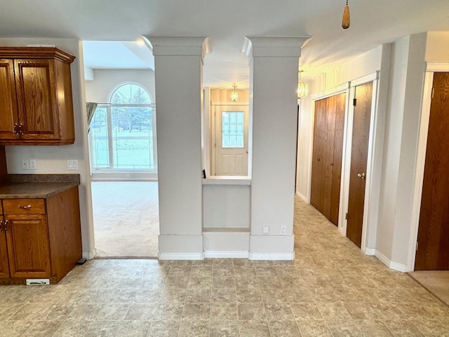 kitchen featuring light carpet