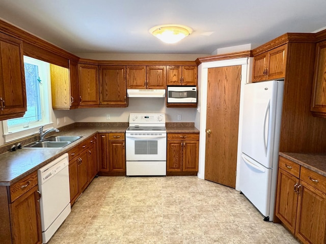 kitchen featuring white appliances and sink