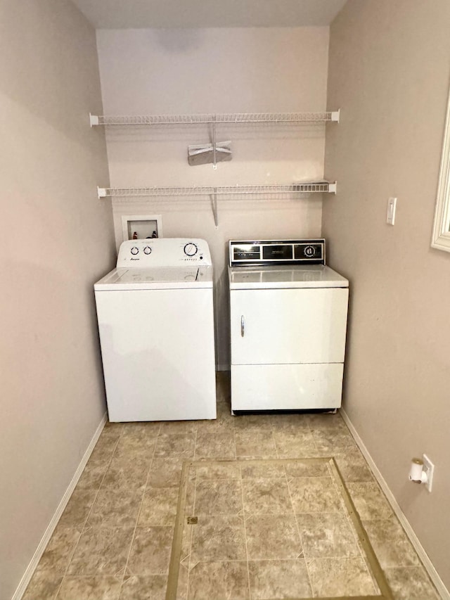 washroom with separate washer and dryer