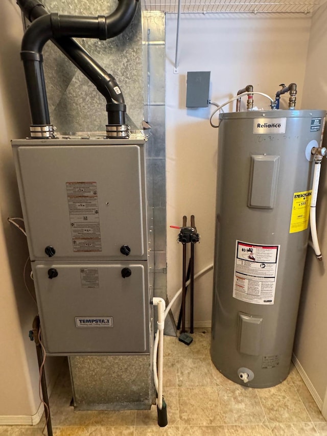 utility room featuring water heater