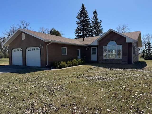 ranch-style home featuring an attached garage, roof with shingles, and driveway