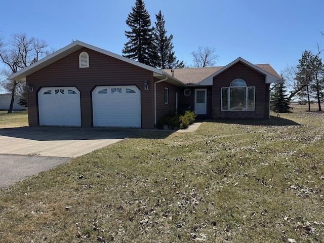 ranch-style home with a shingled roof, an attached garage, driveway, and a front yard