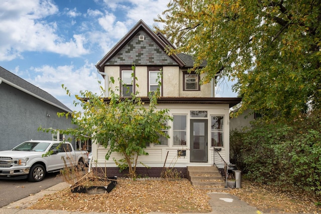 view of front of house with a sunroom