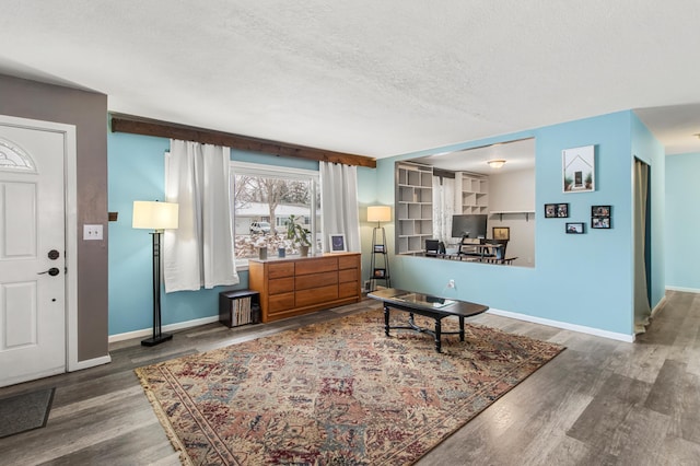 living room with hardwood / wood-style flooring and a textured ceiling