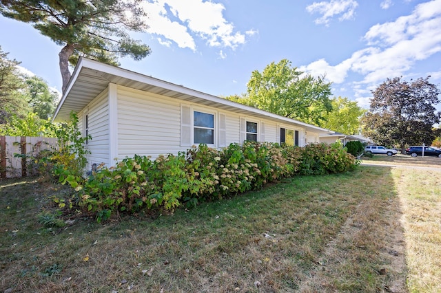 view of home's exterior featuring a lawn