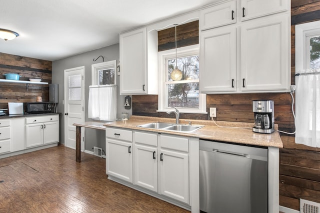 kitchen with dishwasher, hanging light fixtures, plenty of natural light, and sink