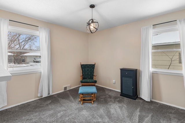 unfurnished room featuring dark colored carpet