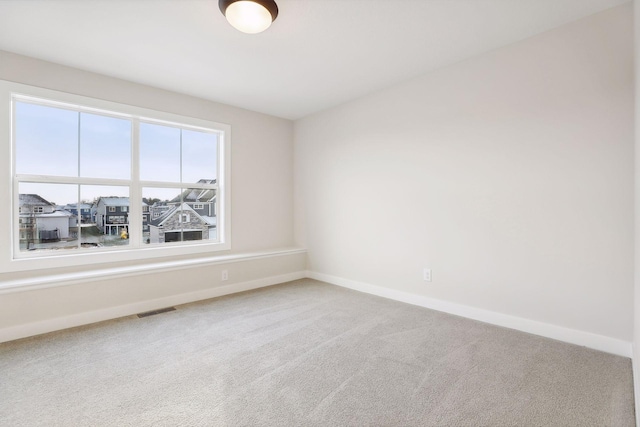 empty room featuring carpet floors