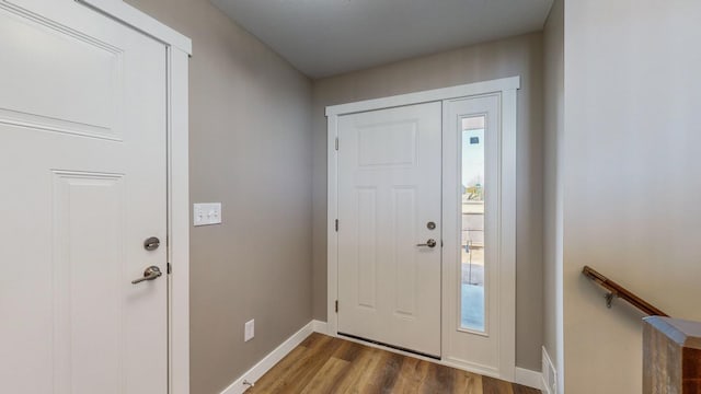 entryway with hardwood / wood-style flooring and a healthy amount of sunlight