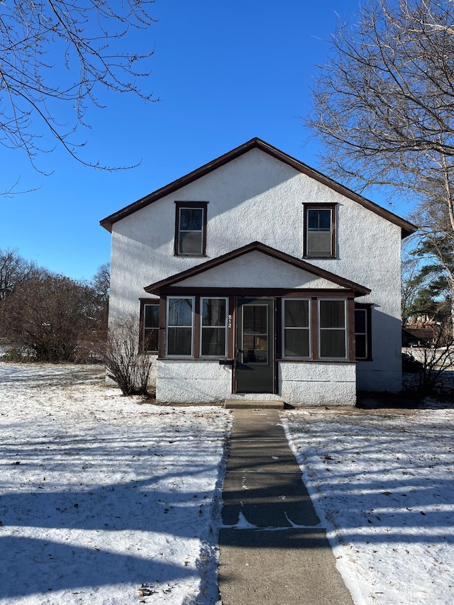 view of front of property with a sunroom