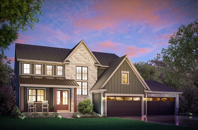 view of front of house with a porch and a garage