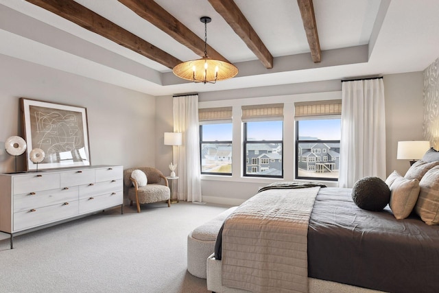 carpeted bedroom featuring beamed ceiling and multiple windows