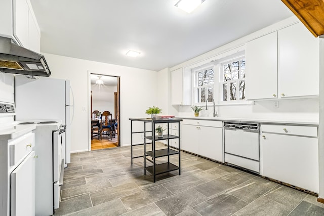 kitchen with sink, white cabinets, white appliances, and ventilation hood