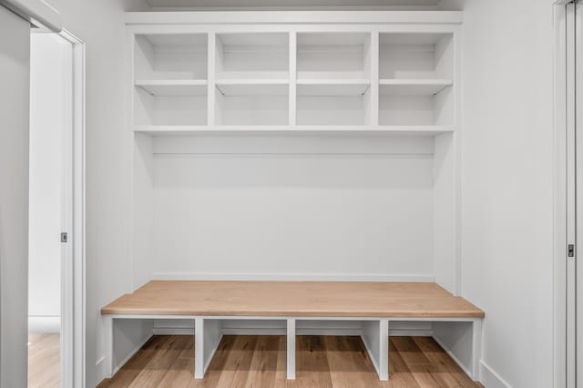 mudroom with wood-type flooring