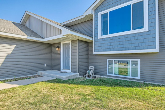 entrance to property with a yard