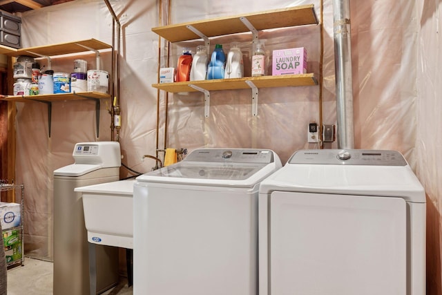 laundry area featuring independent washer and dryer and laundry area