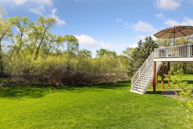 view of yard featuring stairway and a wooden deck
