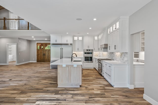 kitchen featuring white cabinetry, dark wood-type flooring, and high end appliances