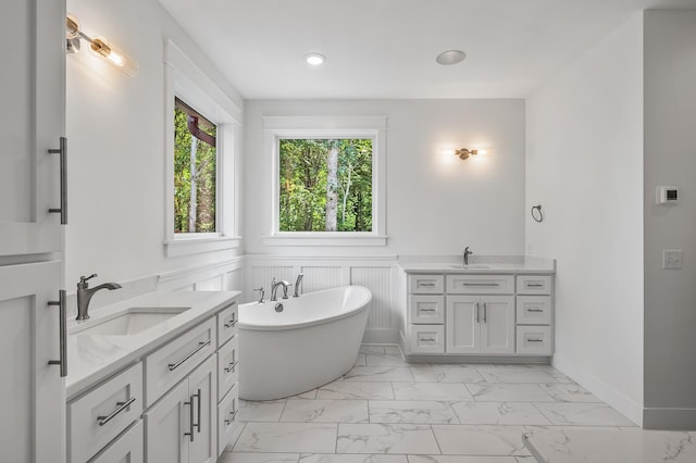 bathroom with vanity and a bathtub